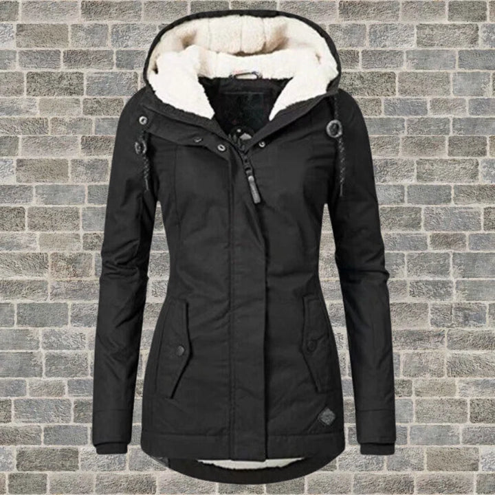 Back view of women's hooded parka jacket showing relaxed fit and hip length