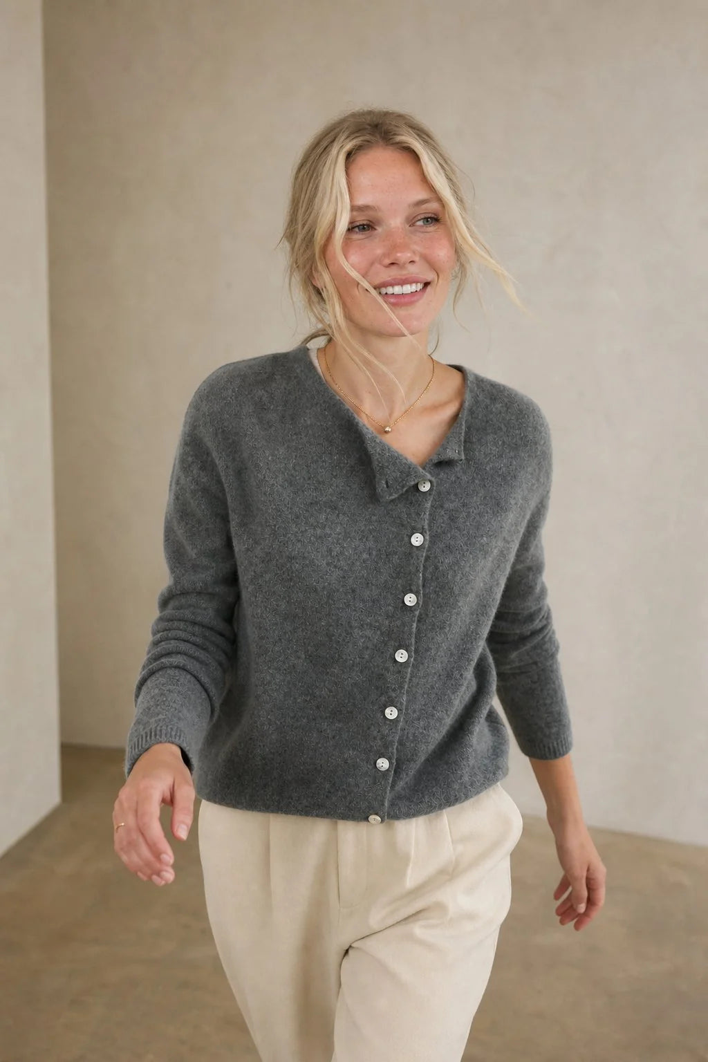 Detail shot of the long sleeves and ribbed cuffs on a women's knit cardigan