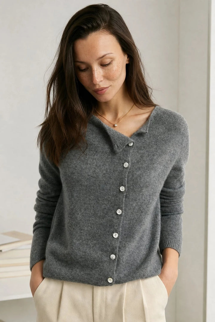 Full-length view of a women's beige cardigan with long sleeves and hip-length hem