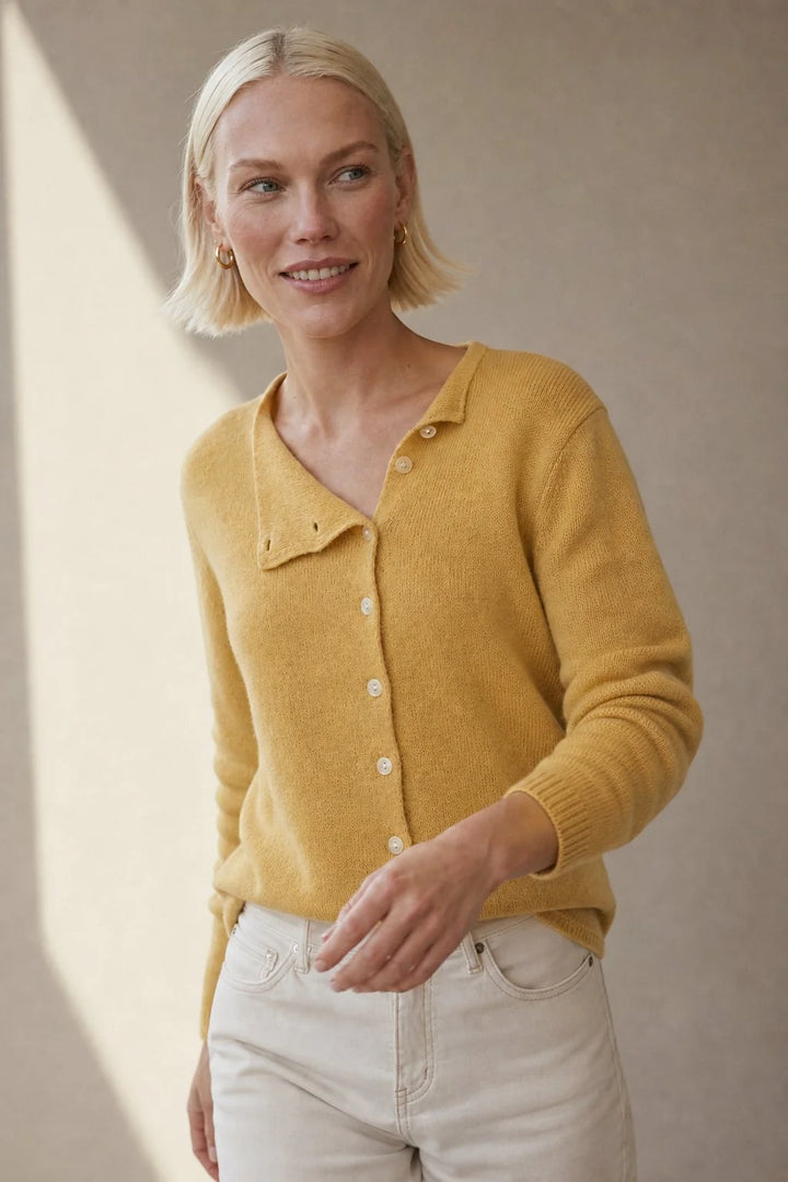 Back view showing the hip-length hem and relaxed fit of a women's knit cardigan