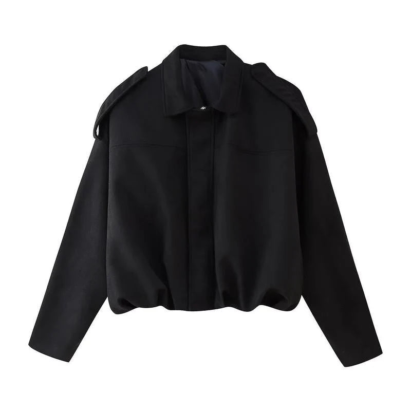 Back view of women's cropped zip jacket showing structured silhouette and cropped length