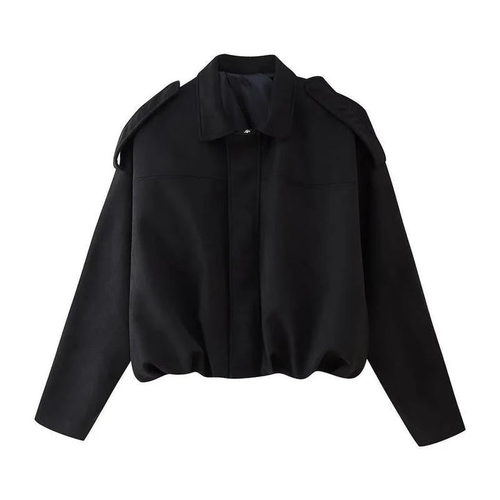 Back view of women's cropped zip jacket showing structured silhouette and cropped length
