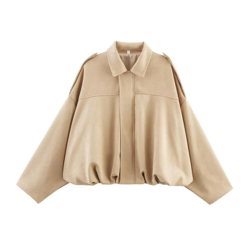 Women's cropped zip jacket flat lay showing satin-lined interior and zip closure detail