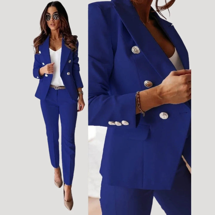 Front view of double breasted blazer set styled with white top and pointed heels