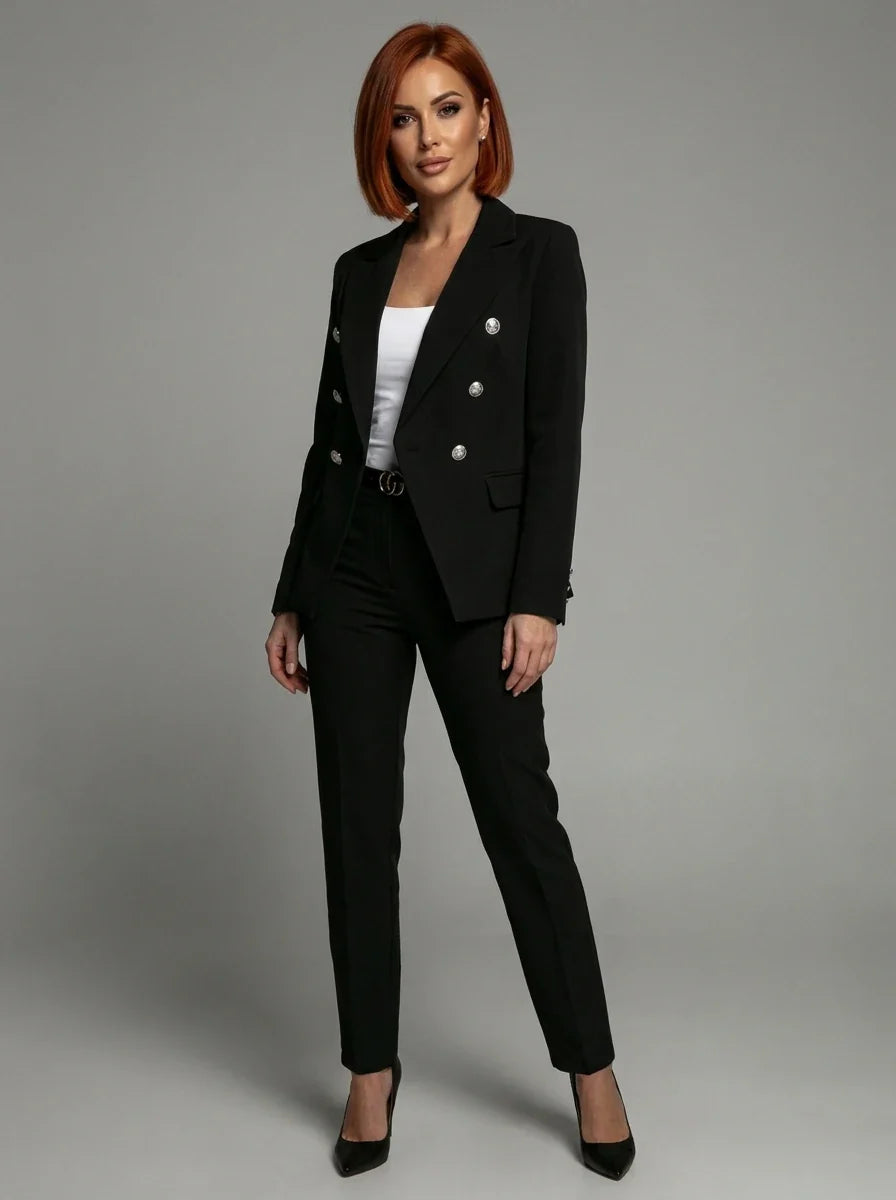 Full-length view of women's tailored blazer and trouser set in black with structured fit