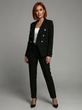Full-length view of women's tailored blazer and trouser set in black with structured fit