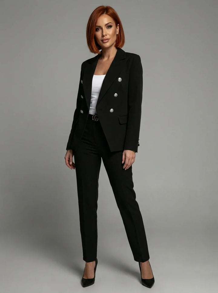 Full-length view of women's tailored blazer and trouser set in black with structured fit