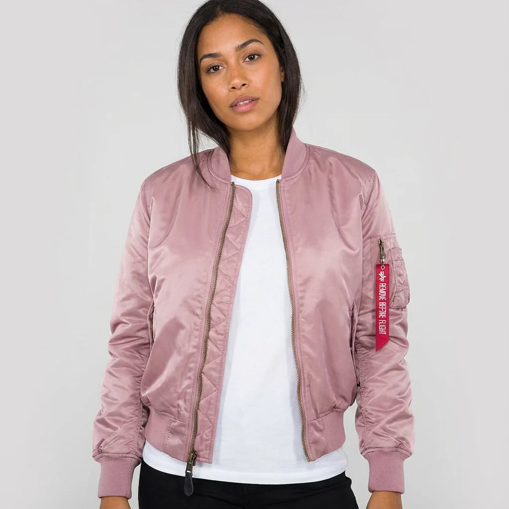 Women's red bomber jacket layered over casual outfit for smart-casual styling