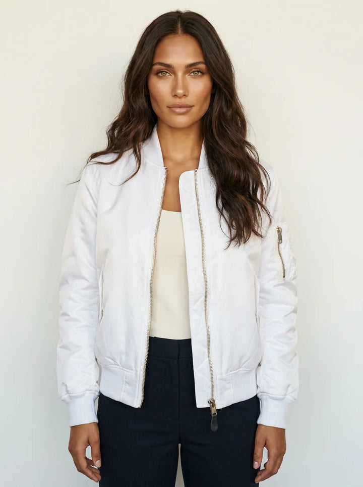 Women's bomber jacket styled open with casual layering pieces for versatile look