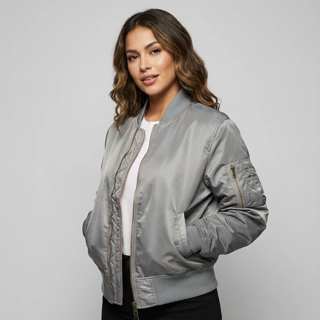 Detail shot of MA-1 utility sleeve pocket on women's satin bomber jacket