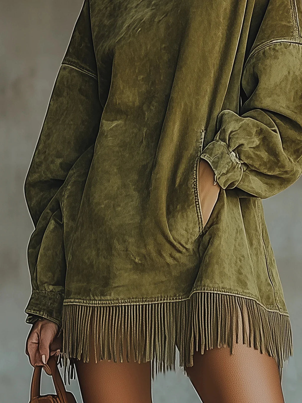Full-length view of suede-effect turtleneck dress with fringe trim hem