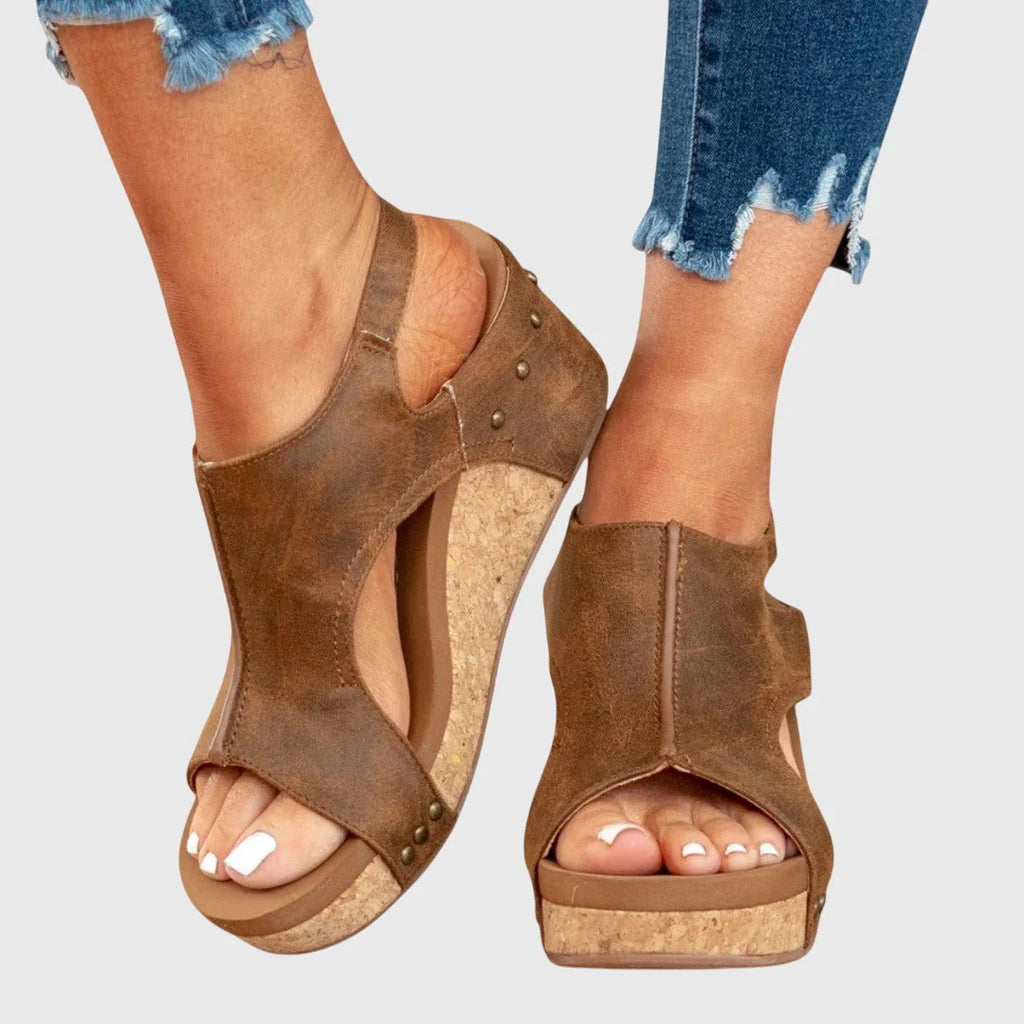 Women's casual wedge sandals with cushioned footbed and adjustable strap closure