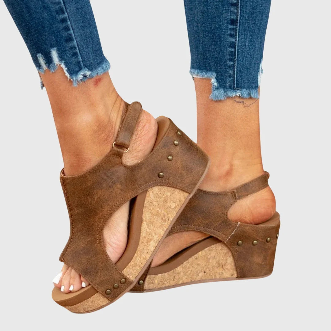 Women's slingback wedge sandals with wide strap and textured upper finish
