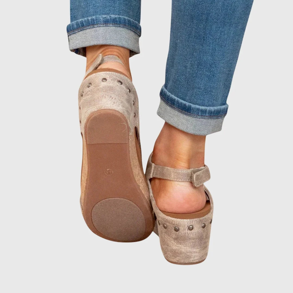 Side profile of women's cork wedge sandals with slingback strap and cushioned footbed