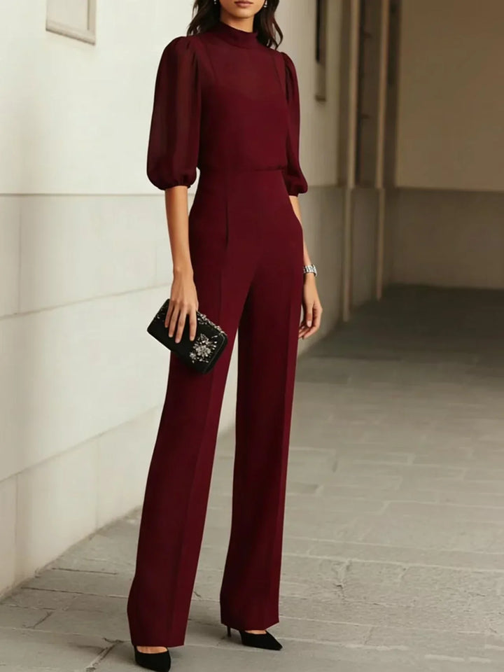 Side view of wide leg trousers with front pleats and high waist fit in black