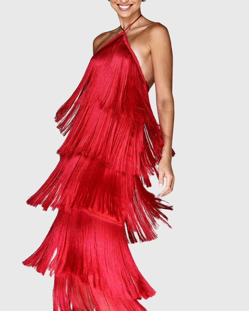 Halter neck fringe dress in red with tiered tassel detailing and flowing silhouette for evening occasions