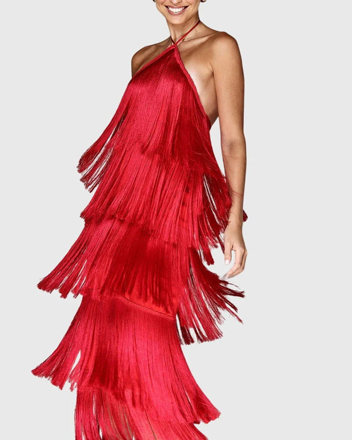 Halter neck fringe dress in red with tiered tassel detailing and flowing silhouette for evening occasions