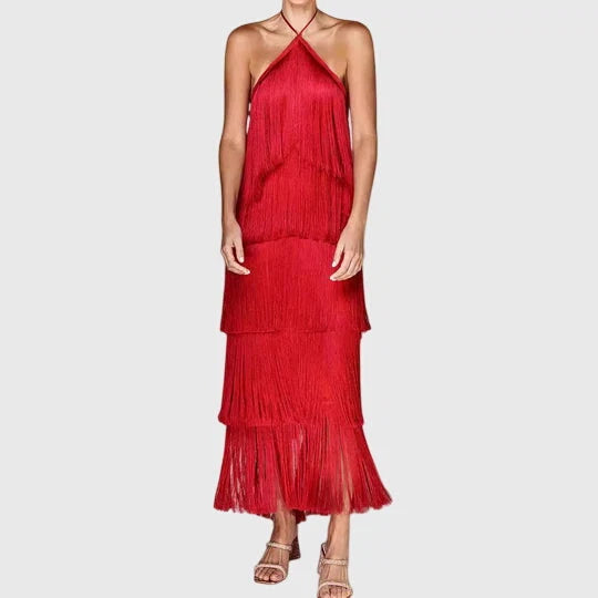 Side view of halter neck fringe dress showing cascading tassel layers and open back design
