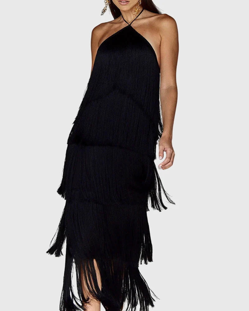 Close-up of fringe dress halter neckline with twisted strap detailing and smooth fabric finish