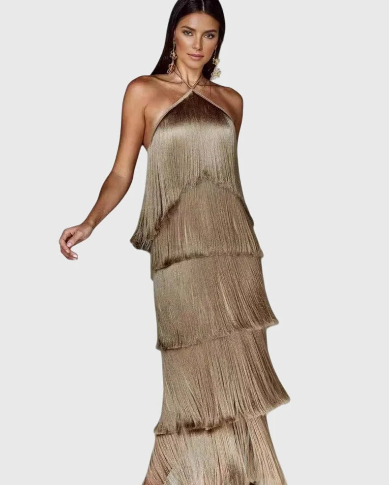 Detail shot of tiered fringe tassels on halter neck dress with flowing layers