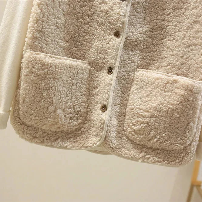 Layered styling of brown fleece gilet over cream turtleneck jumper showing versatile autumn outfit