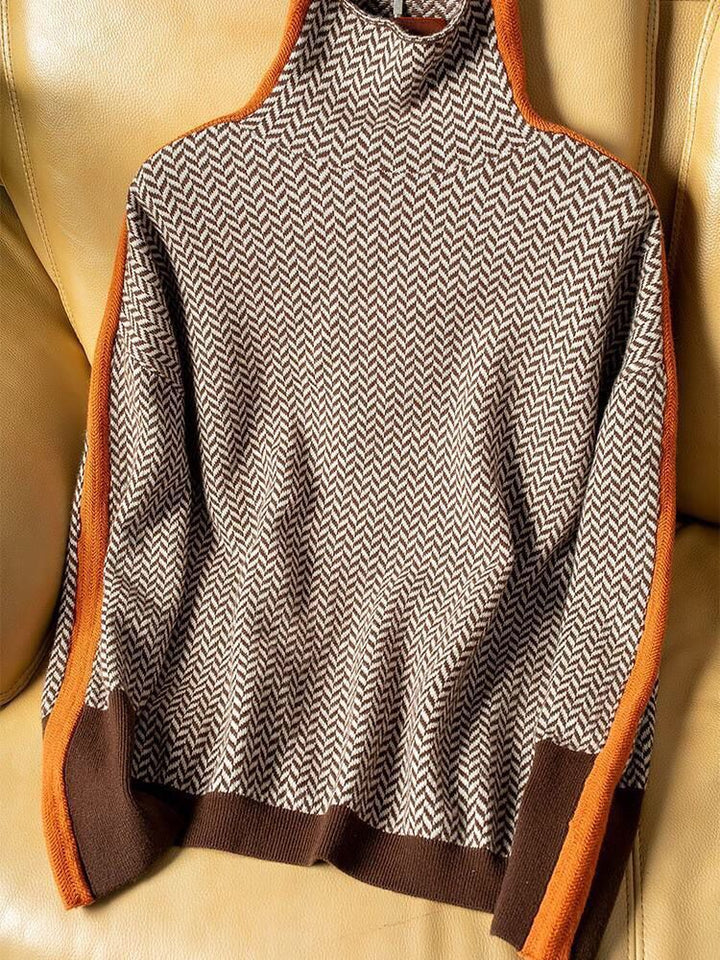 Close-up of woven chevron herringbone pattern on women's jumper with contrast ribbed detailing