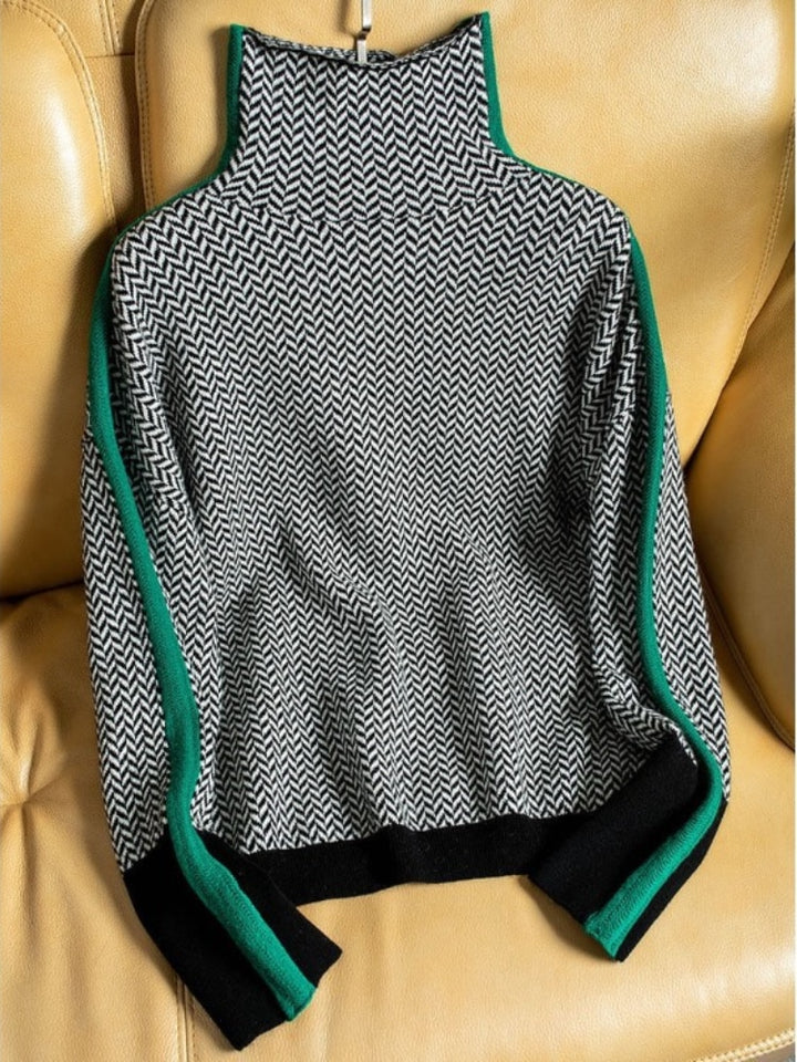 Side view of relaxed fit herringbone jumper styled with neutral tailored trousers