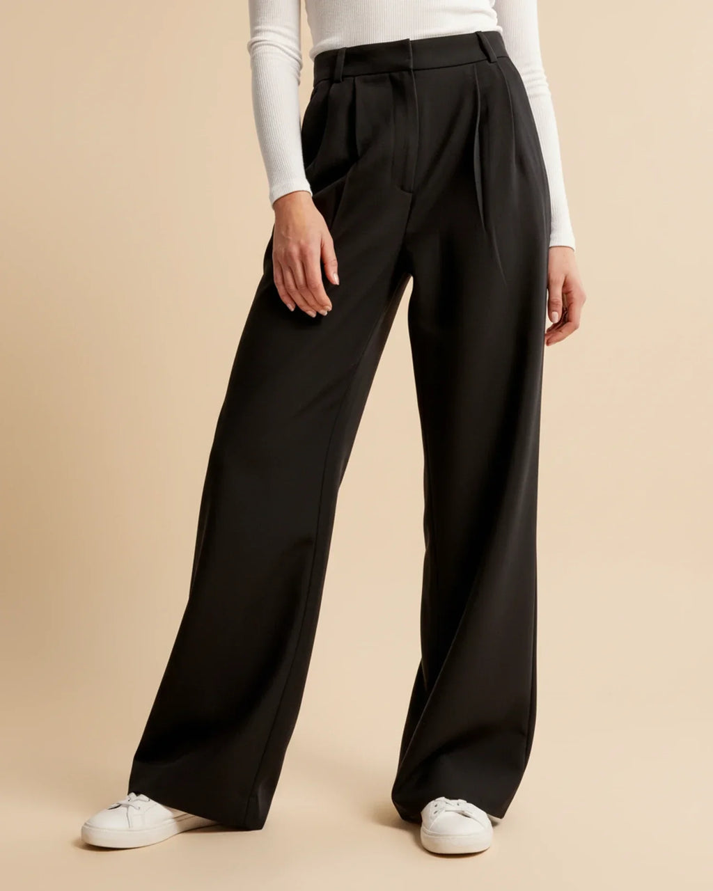 Back view of tailored pleated trousers with straight-leg cut and high waist design