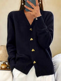Women's knit cardigan in black with V-neck and decorative heart-shaped button closures down the front