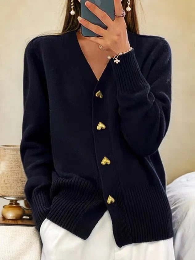 Women's knit cardigan in black with V-neck and decorative heart-shaped button closures down the front