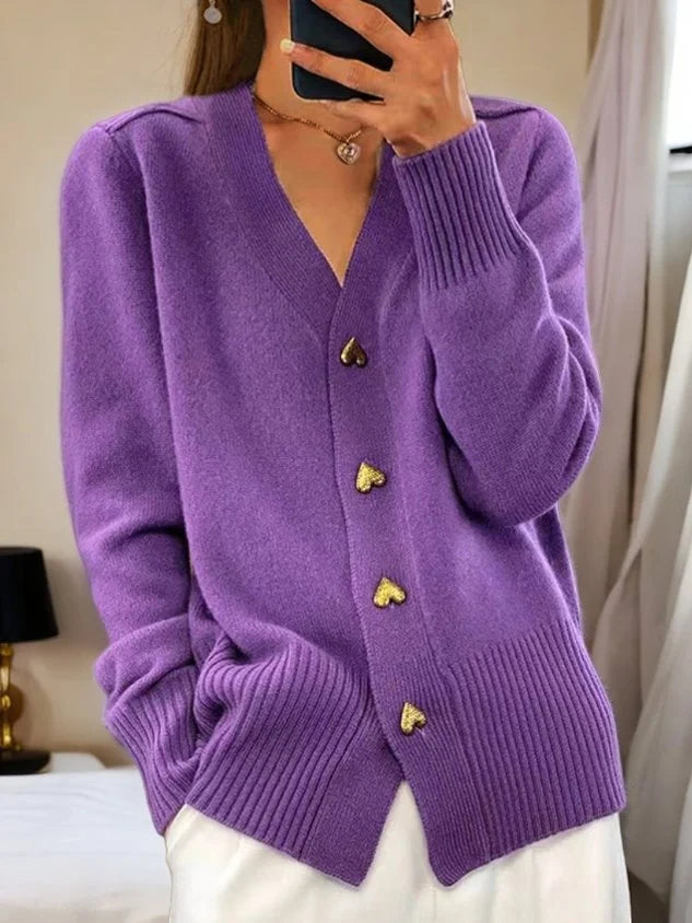 Side view of relaxed fit knit cardigan showing ribbed hem and soft drape