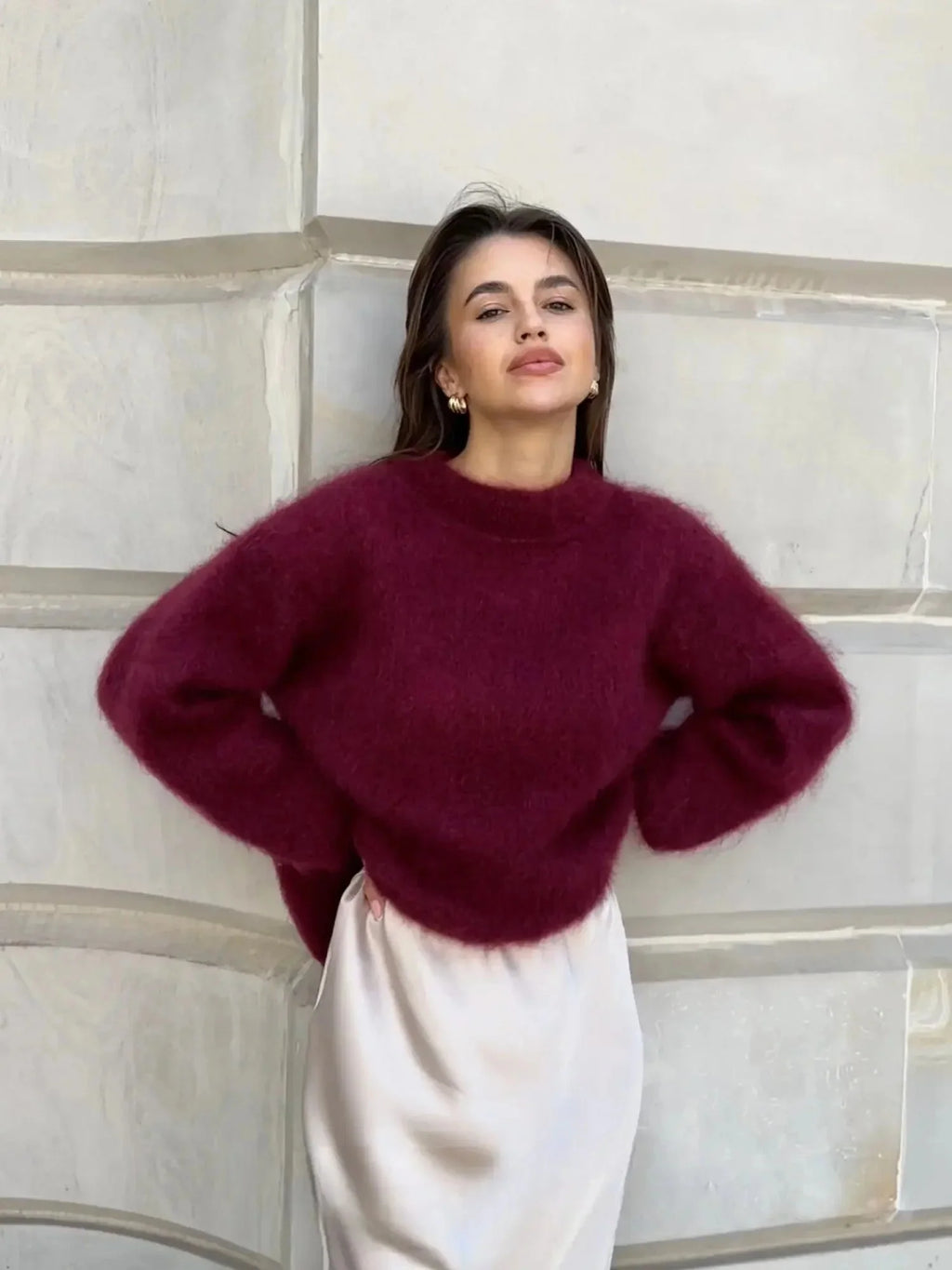 Side view of women's oversized jumper with dropped shoulders and relaxed silhouette