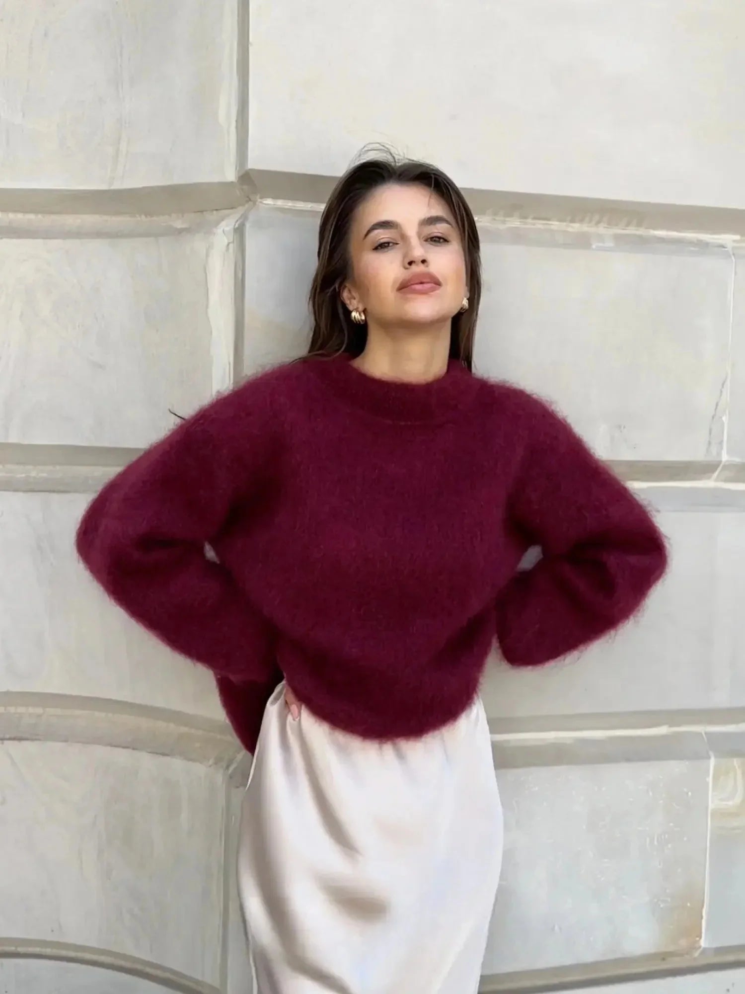 Side view of women's oversized jumper with dropped shoulders and relaxed silhouette