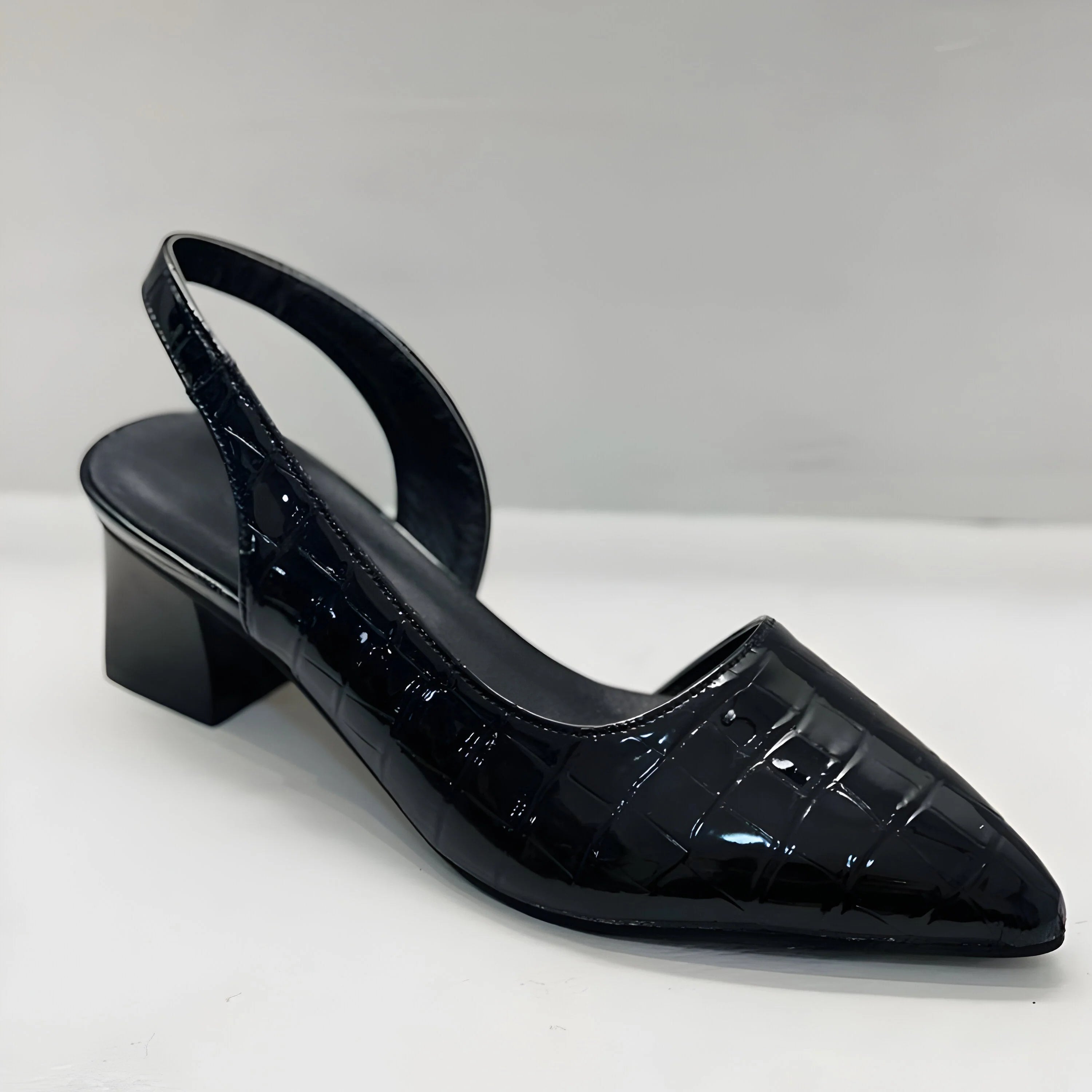 Side angle of women's slingback flats with low block heel and elasticated strap detail