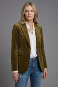 Women's velvet tailored blazer in olive green with notched lapels and single-button closure worn over white shirt