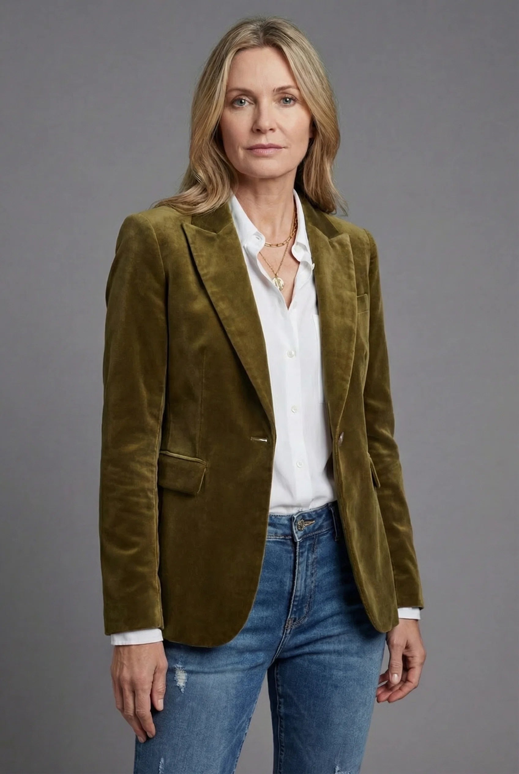 Women's velvet tailored blazer in olive green with notched lapels and single-button closure worn over white shirt