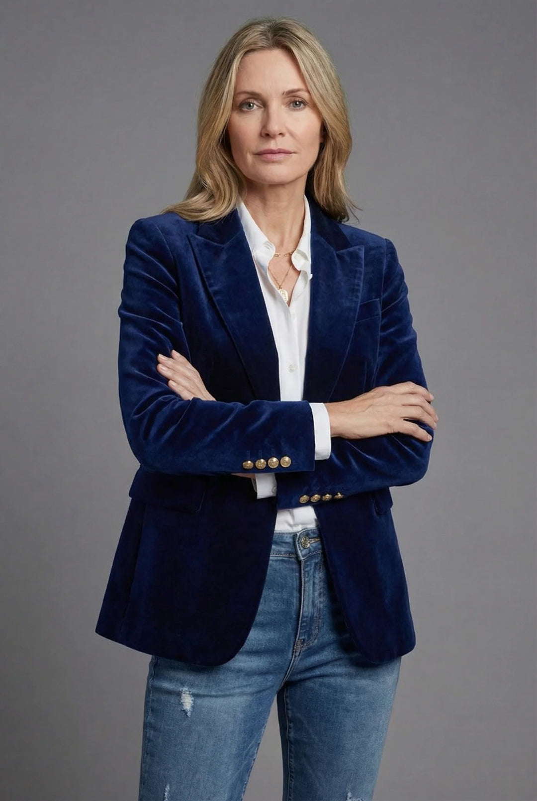 Full-length view of women's tailored velvet blazer showing nipped waist and polished silhouette