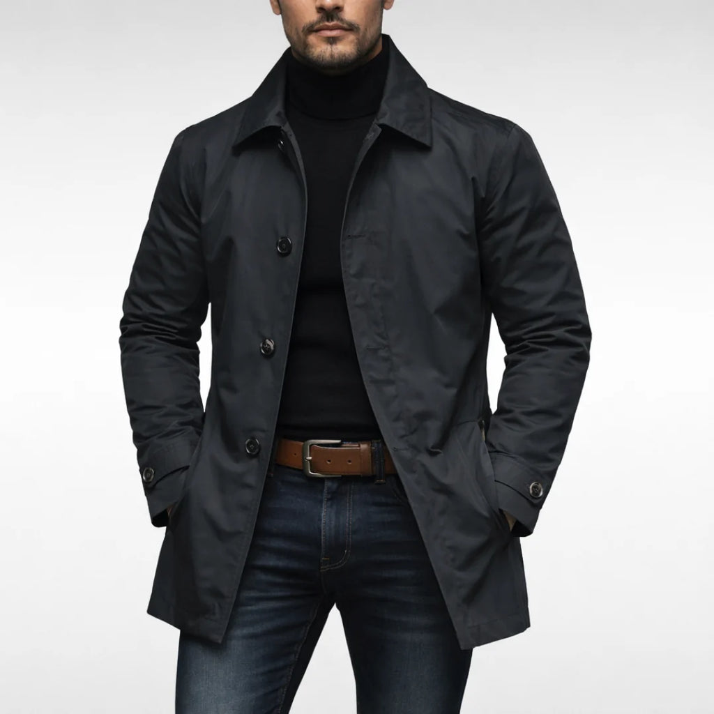 Close-up of men's trench coat showing structured fabric and button detail