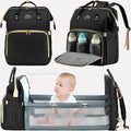 Black nappy bag backpack with beige trim, dual top handles, and organised compartments for parents