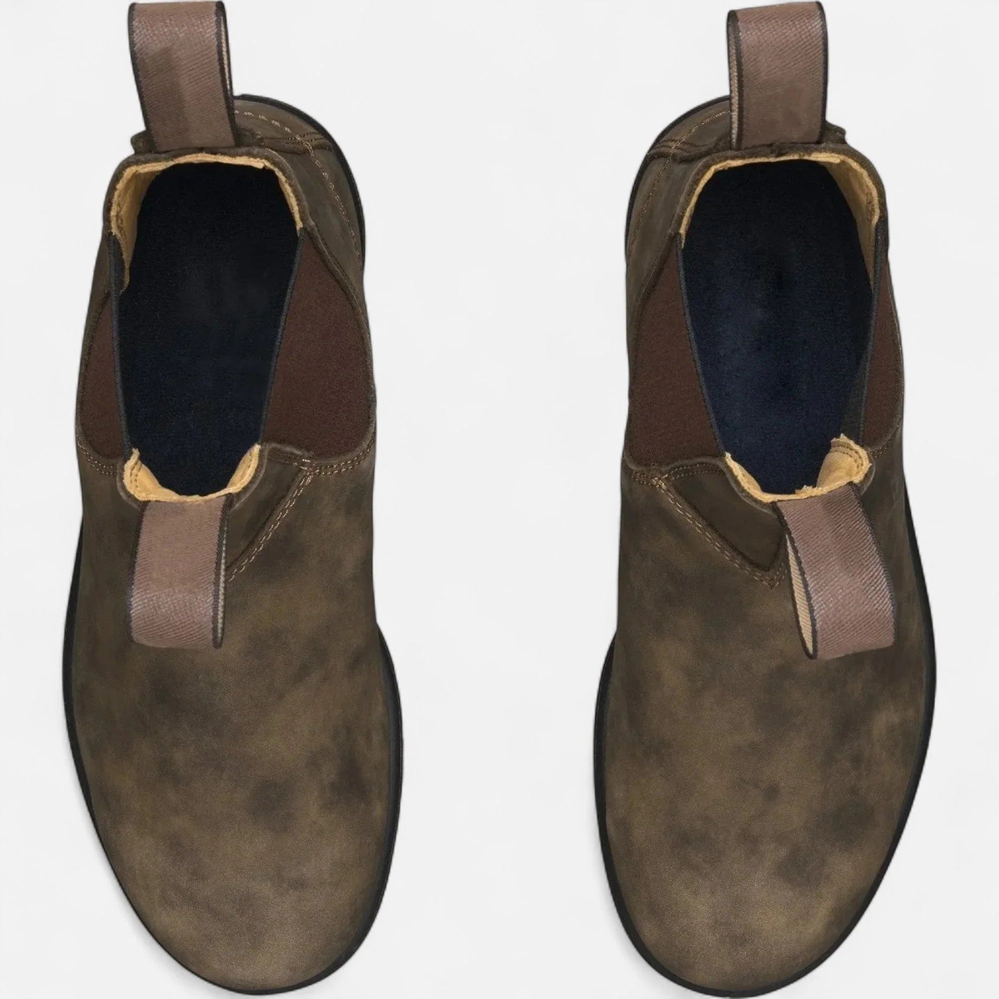 Men's Chelsea boots featuring chunky sole and structured upper with fabric pull tabs