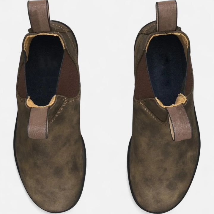 Men's Chelsea boots featuring chunky sole and structured upper with fabric pull tabs