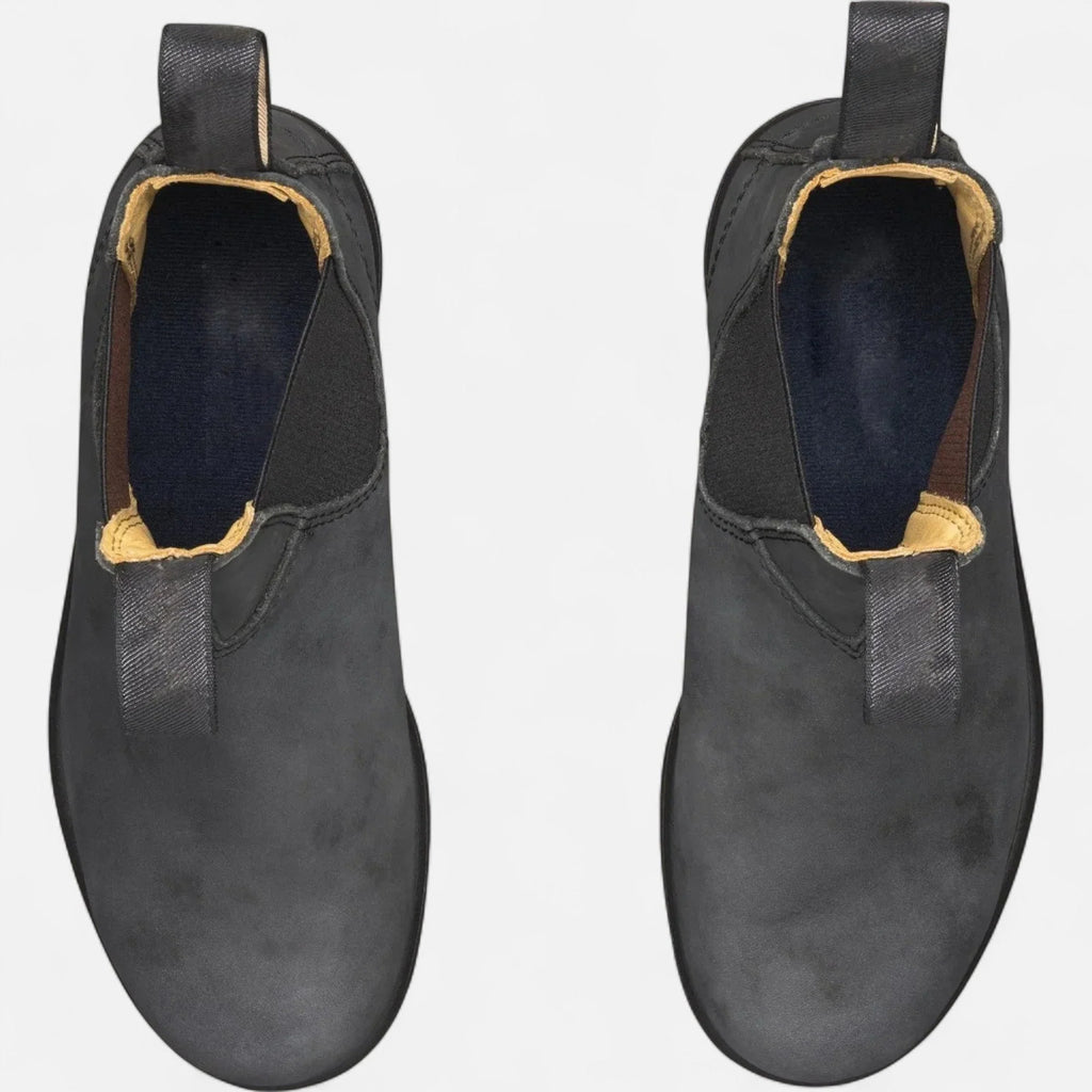 Ankle boots for men featuring slip-on construction and contrast fabric pull tabs