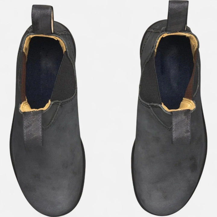 Ankle boots for men featuring slip-on construction and contrast fabric pull tabs