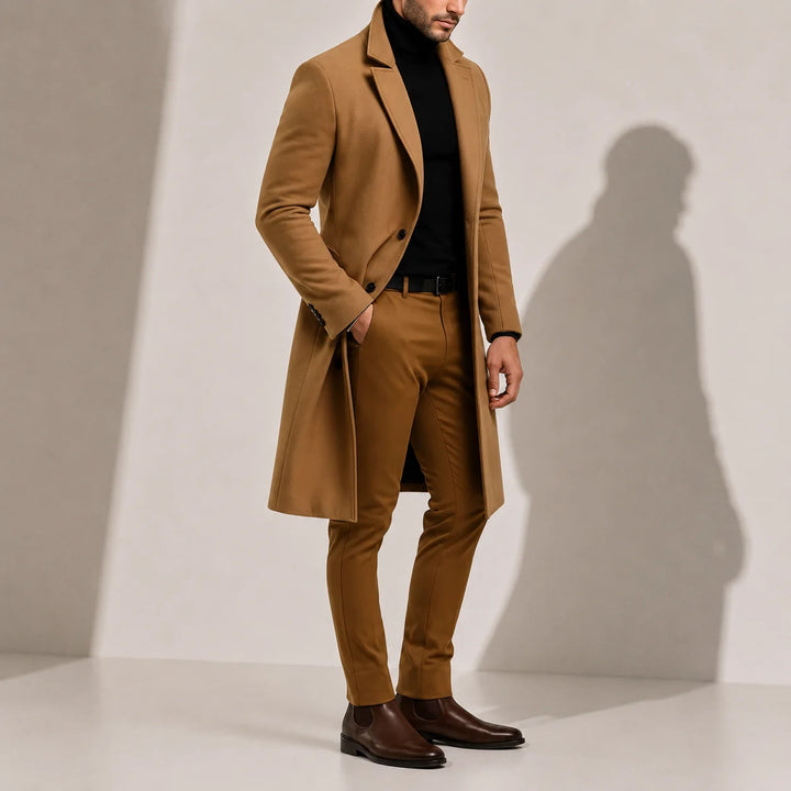 Close-up view of men's long overcoat showing notch lapel collar and structured fabric detail