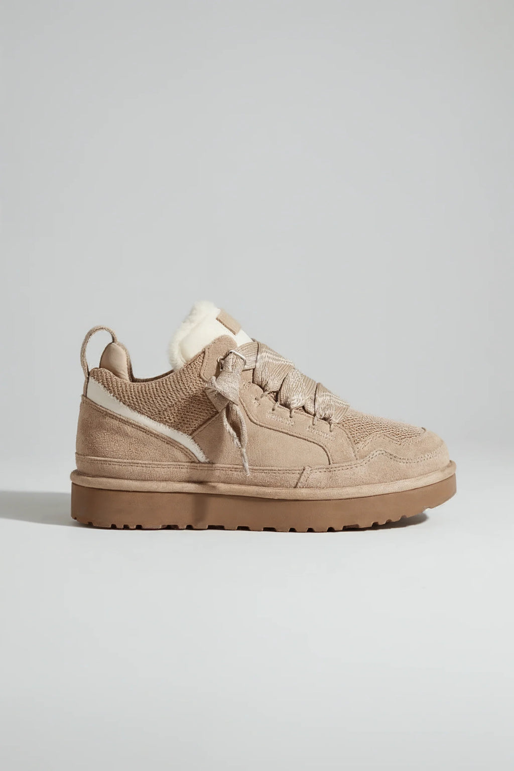 Men's platform trainers in beige with faux fur collar and ridged sole, side view