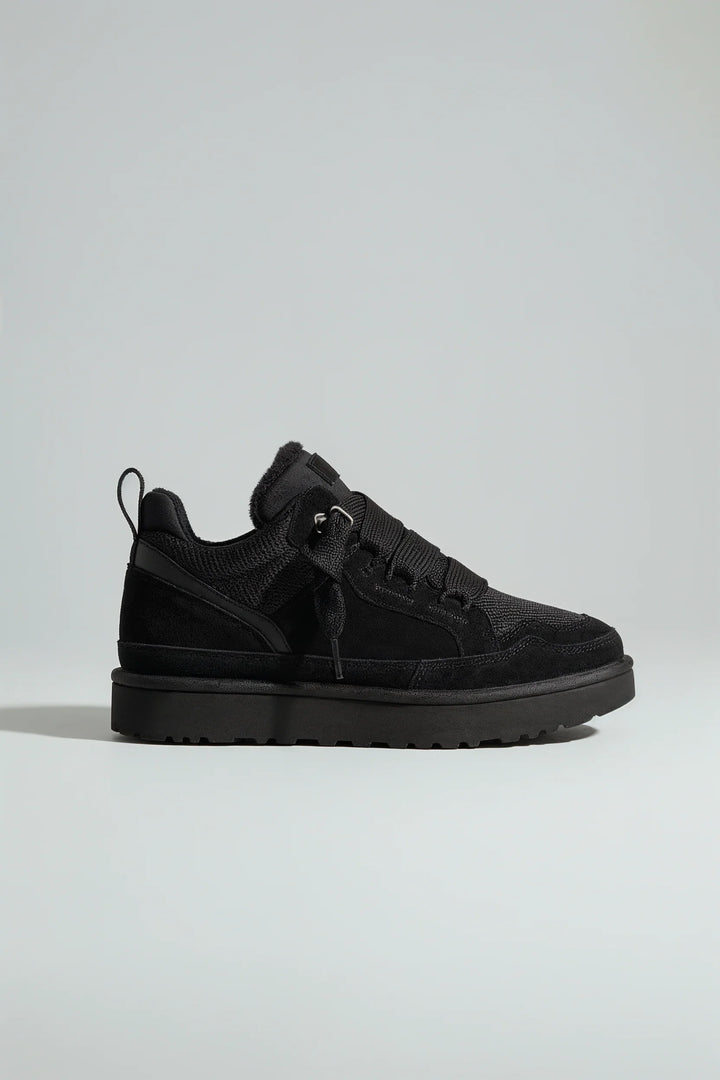 Side profile of platform trainers showing elevated sole and reinforced eyelets