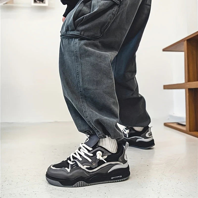 Men's chunky trainers in black with structured upper and sporty silhouette from angle