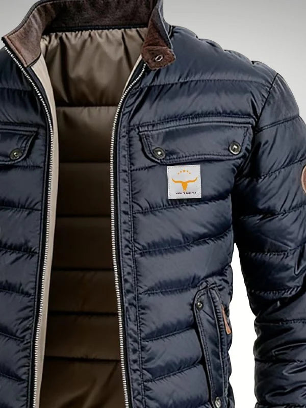 Detail shot of men's quilted jacket chest pockets with snap fastenings and contrast zip hardware