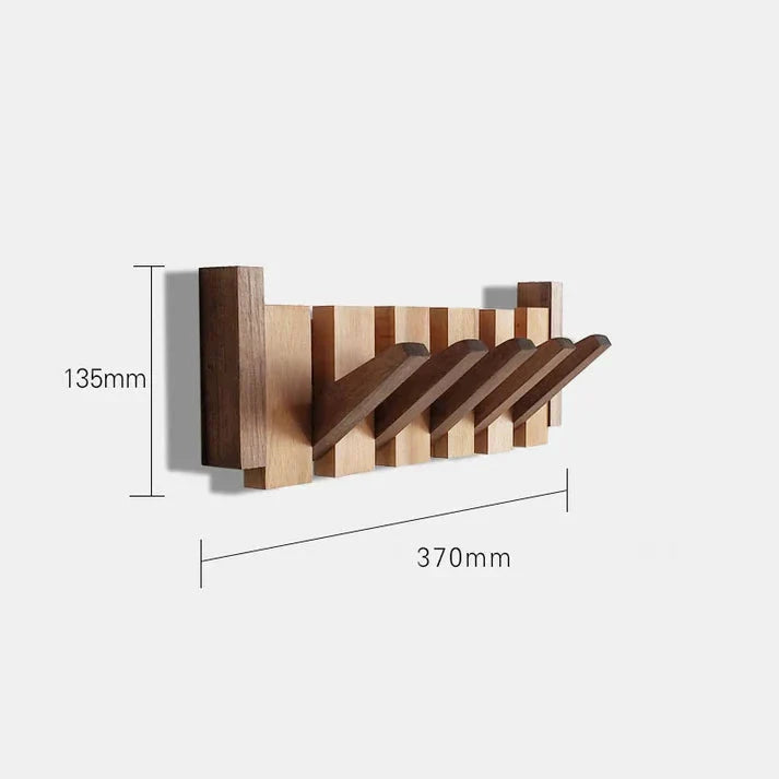 Space-saving wall-mounted coat rack with musical design detail