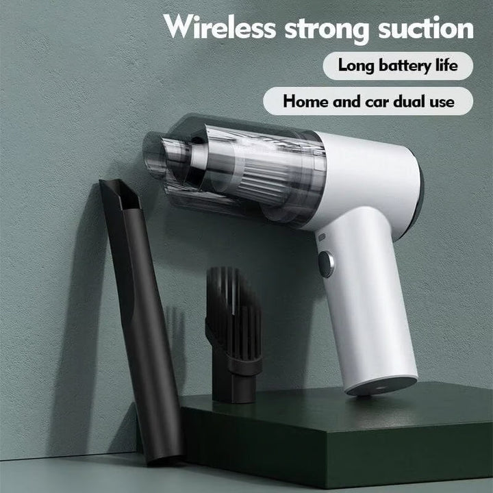 Portable car vacuum cleaner showing pistol-grip handle and cylindrical collection chamber design
